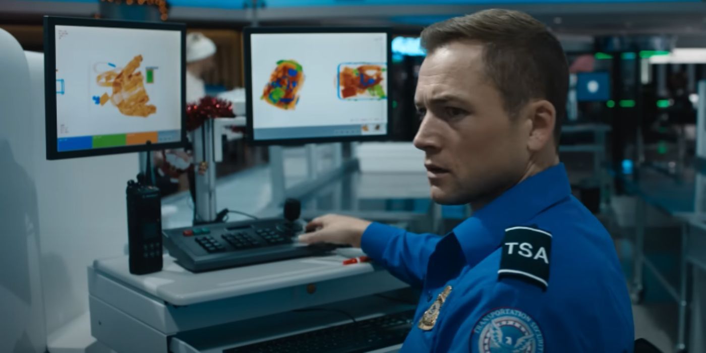 Taron Edgerton looking at an airport security monitor in &lsquo;Carry-On&rsquo;.