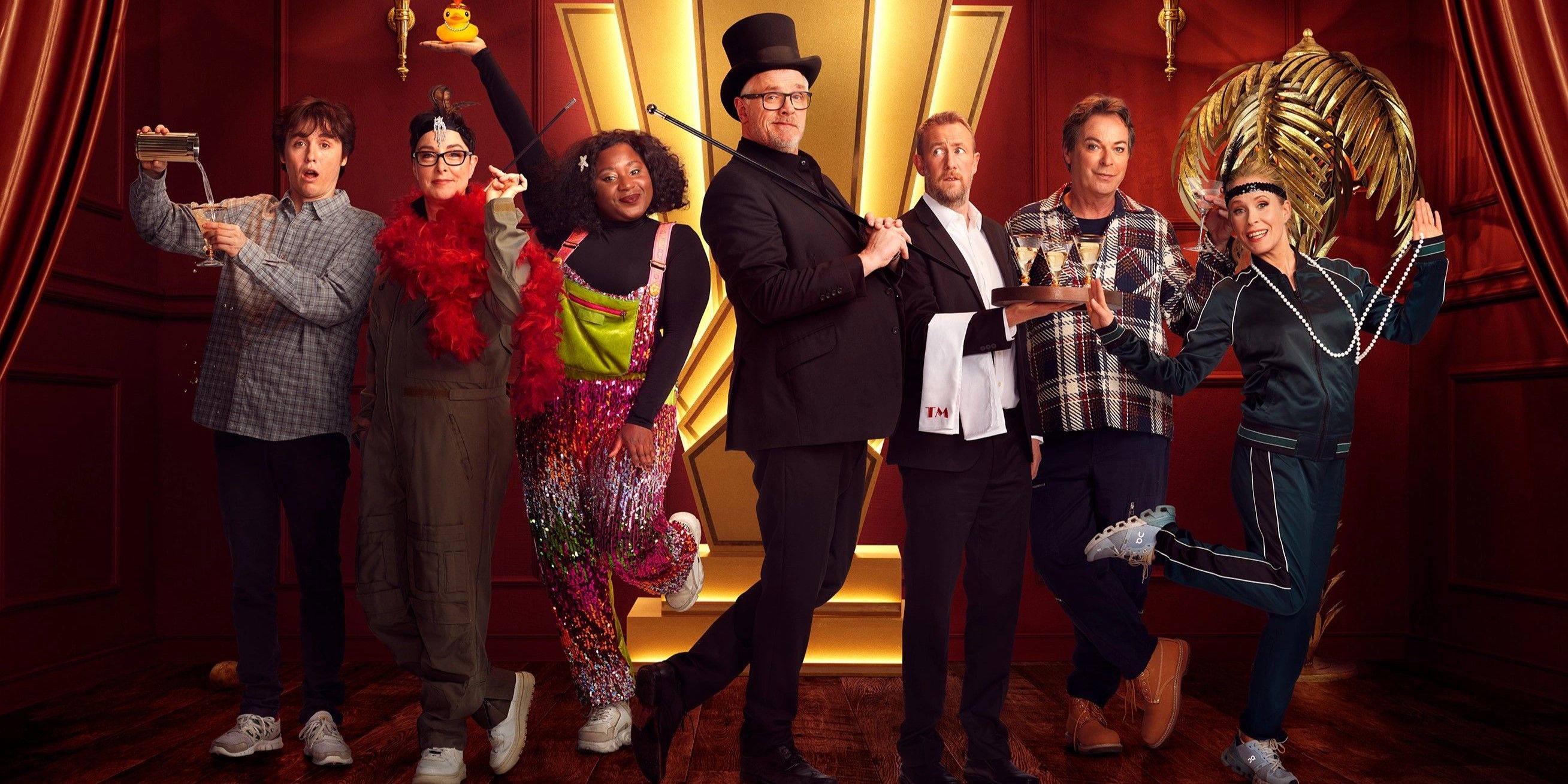 Promo image of the Taskmaster series 16 cast, Julian Clary, Lucy Beaumont, Sam Campbell, Sue Perkins and Susan Wokoma, with hosts Greg Davies and Alex Horne