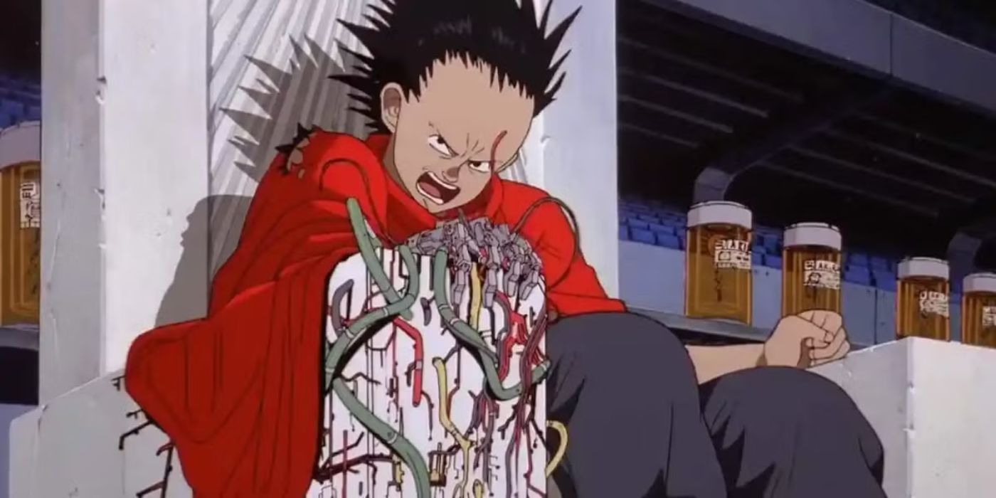 Shima Tetsuo se sienta en el trono sosteniendo una mano de metal con una expresión malvada en el rostro de Akira.