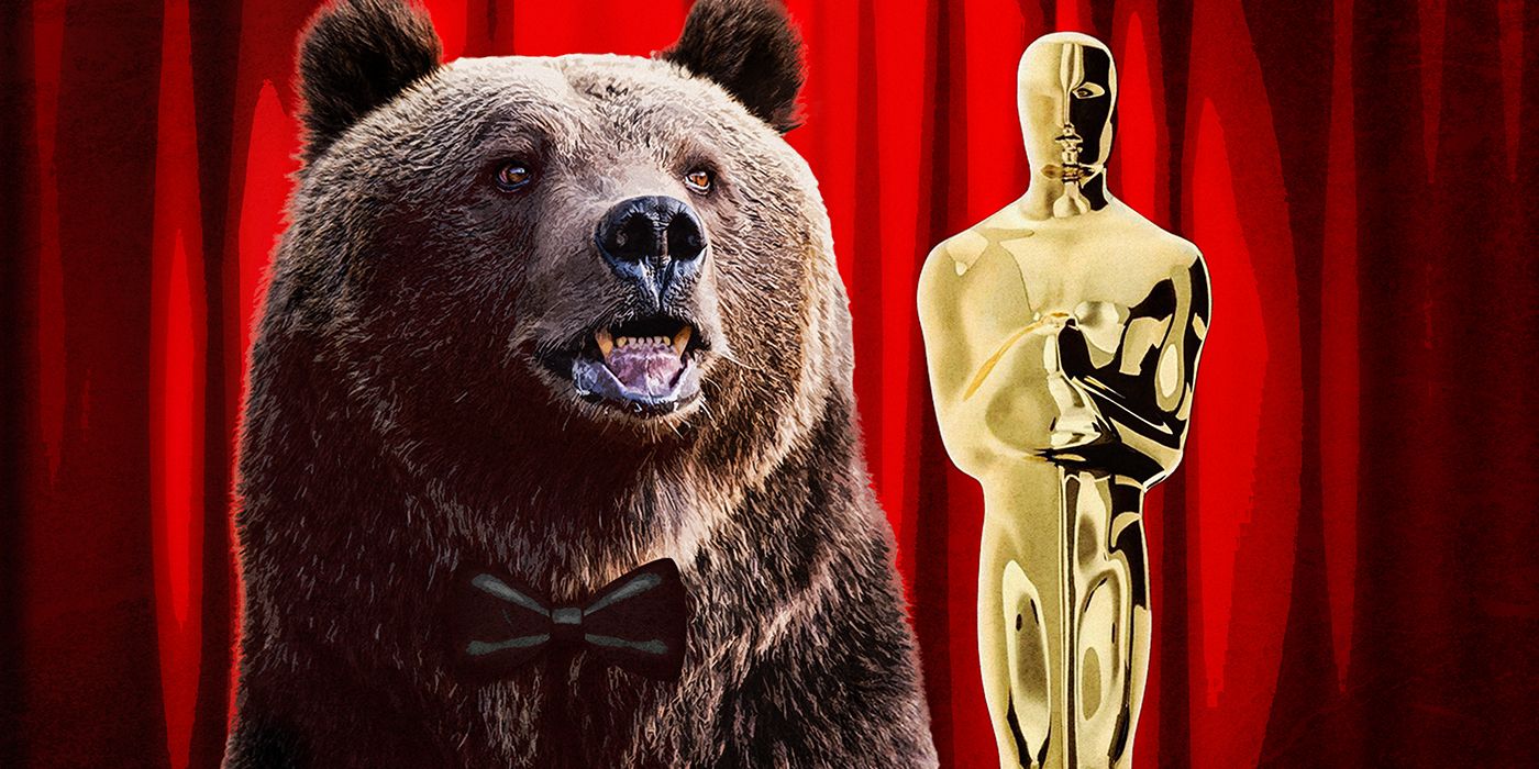 A bear standing beside an Oscar trophy