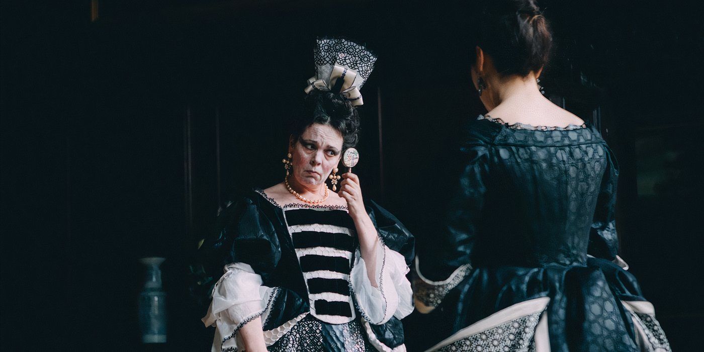 Olivia Colman wears a grand ball gown and looks bemused in The Favourite.?