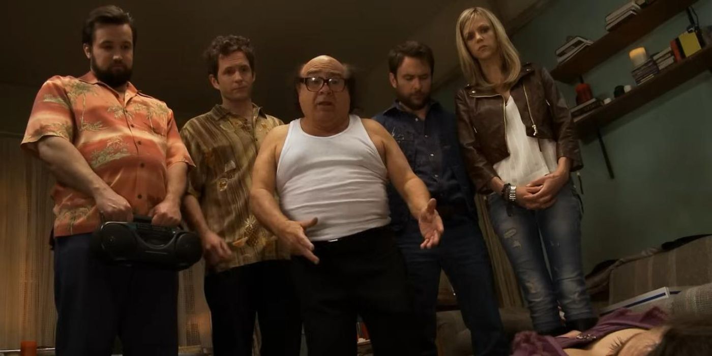 The cast stand above the body of the woman meant to be Frank's new wife in It's Always Sunny in Philadelphia.