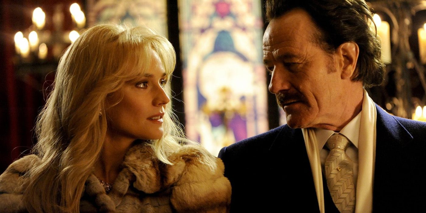 Diane Kruger and Bryan Cranston looking at each other in The Infiltrator