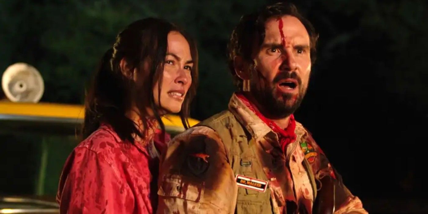 A bloodied Amber (Caitlin McHugh) and Grant (Mike Capes) in &lsquo;The Invisible Raptor&rsquo;