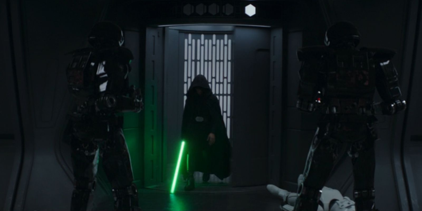 Luke Skywalker exits an elevator with his lightsaber drawn in the second season finale of The Mandalorian.