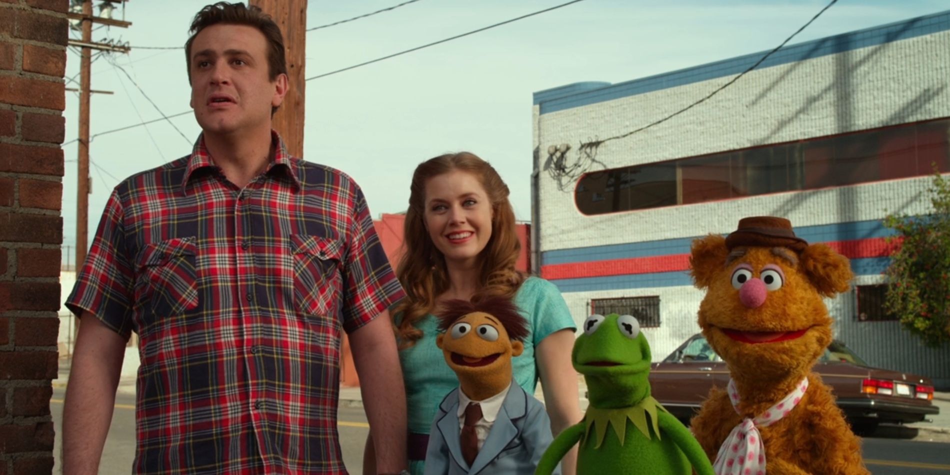 Gary, Walter, Kermit and Fozzie all look worried while Mary smiles in 2011's 'The Muppets'.