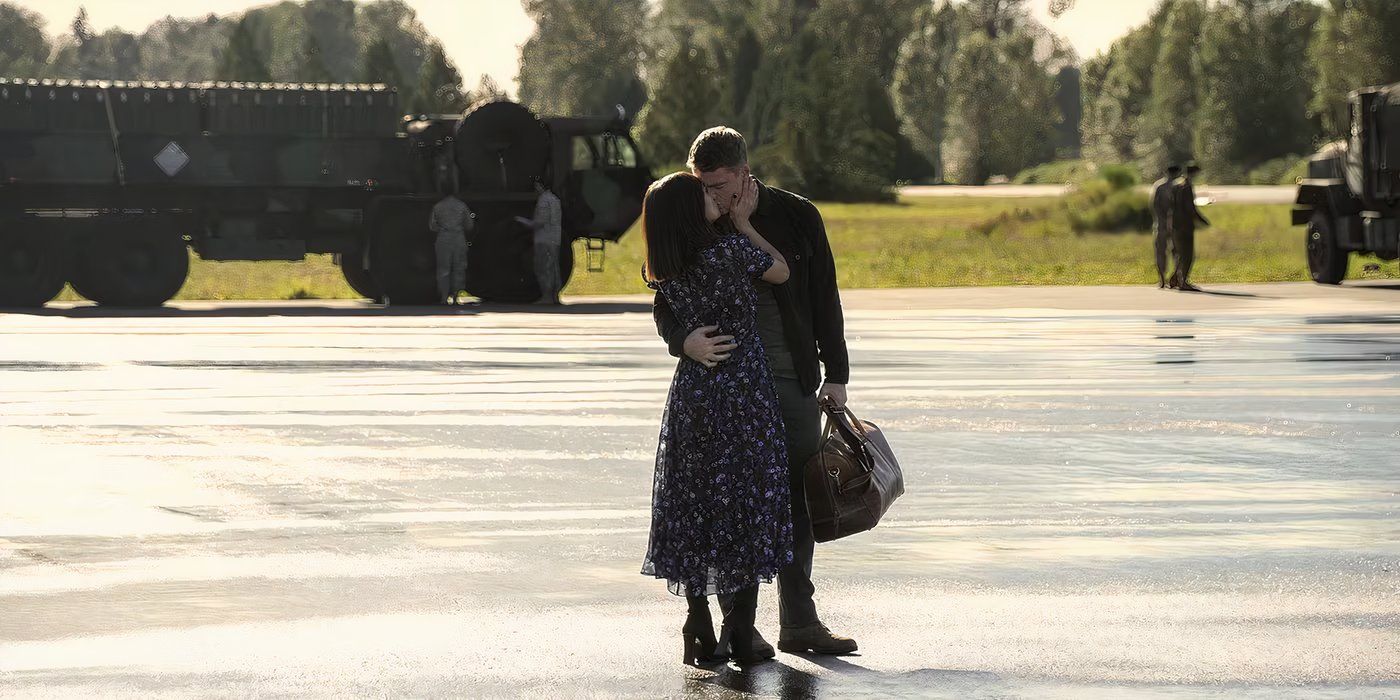 Lucien Buchanan, who plays Rose, and Gabriel Basso, who plays Peter, kiss on the tarmac in The Night Agent.