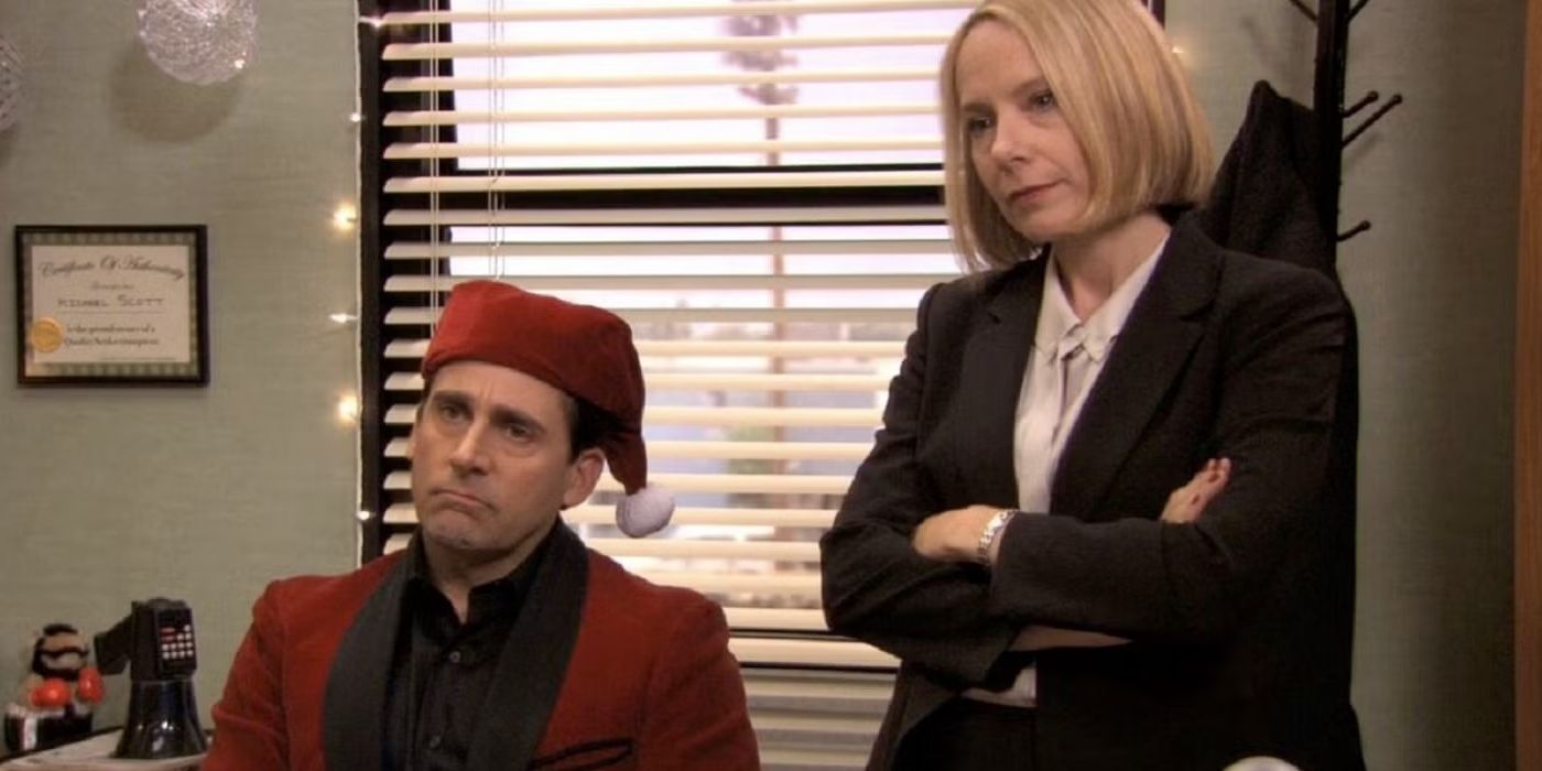 Michael (Steve Carell) with a Santa hat and Holly (Amy Ryan) beside him in The Office Classy Christmas