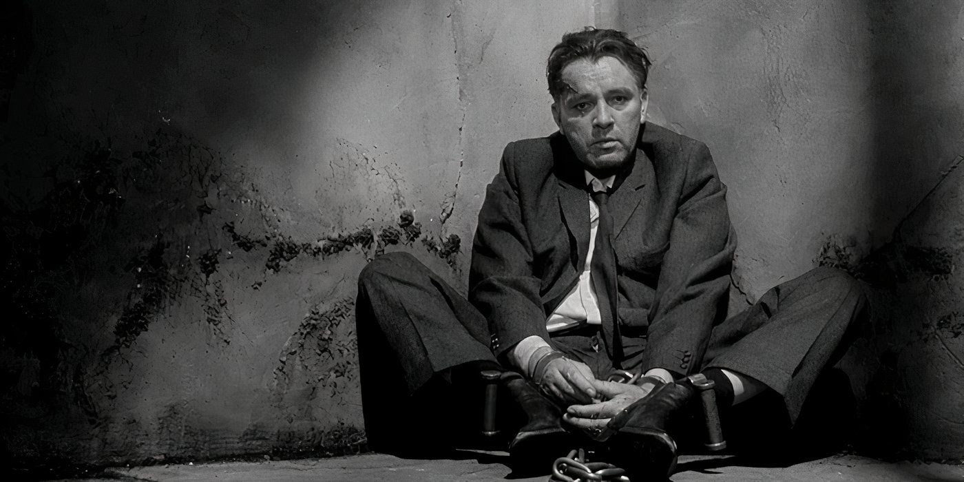 Richard Burton sitting on the ground in 'The Spy Who Came in From the Cold'