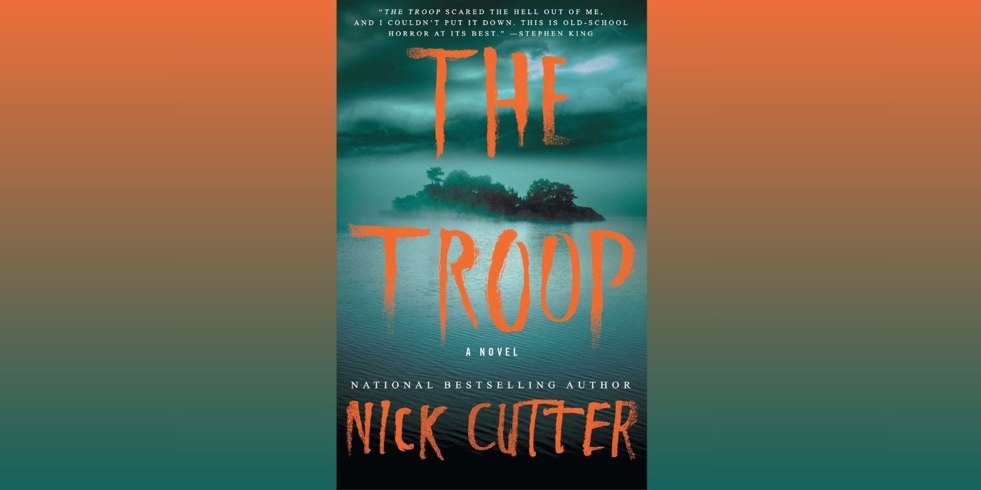 The cover of The Troop by Nick Cutter, which features an image of a small and foggy island surrounded by dark water