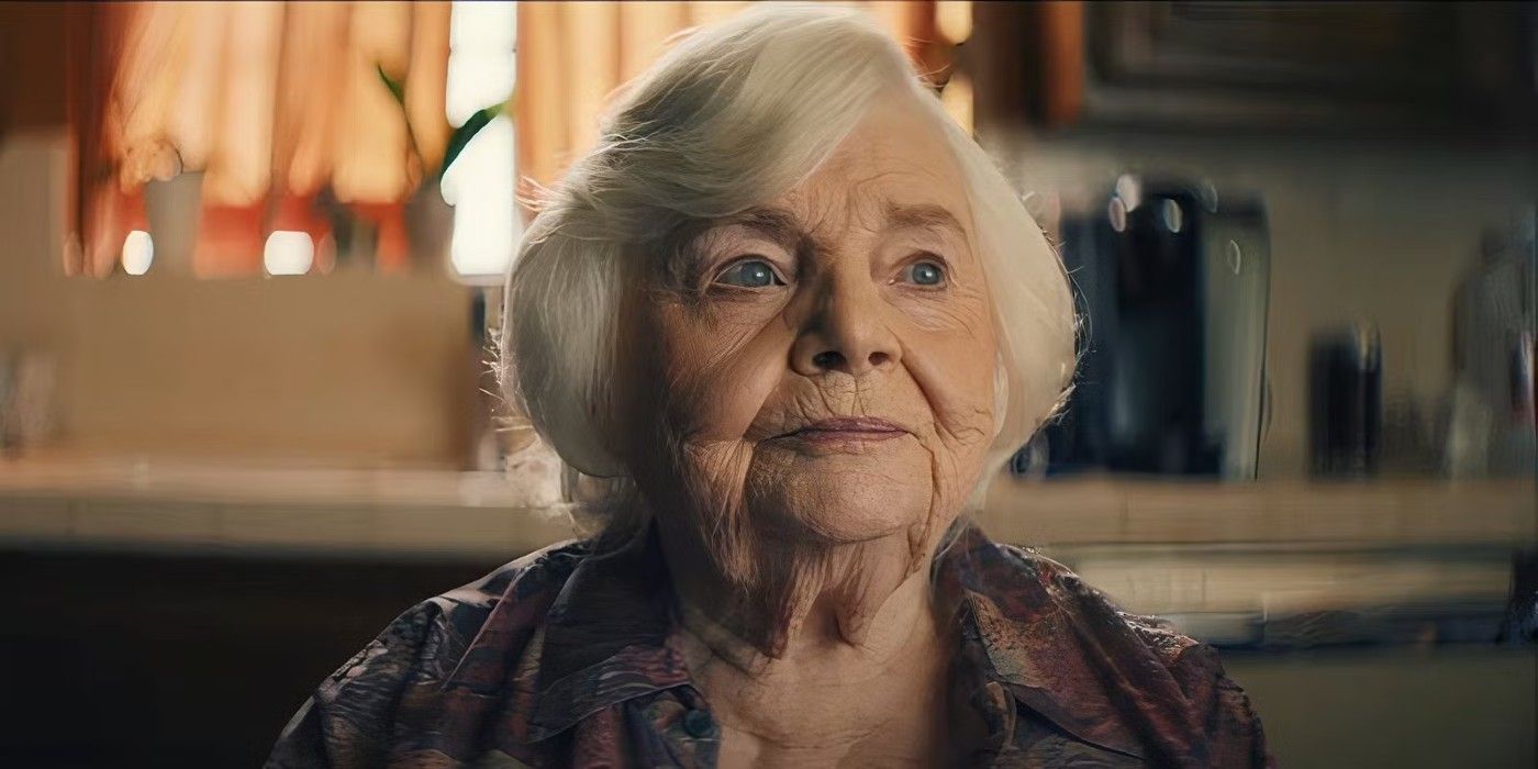 June Squibb sitting in a kitchen in 'Thelma'