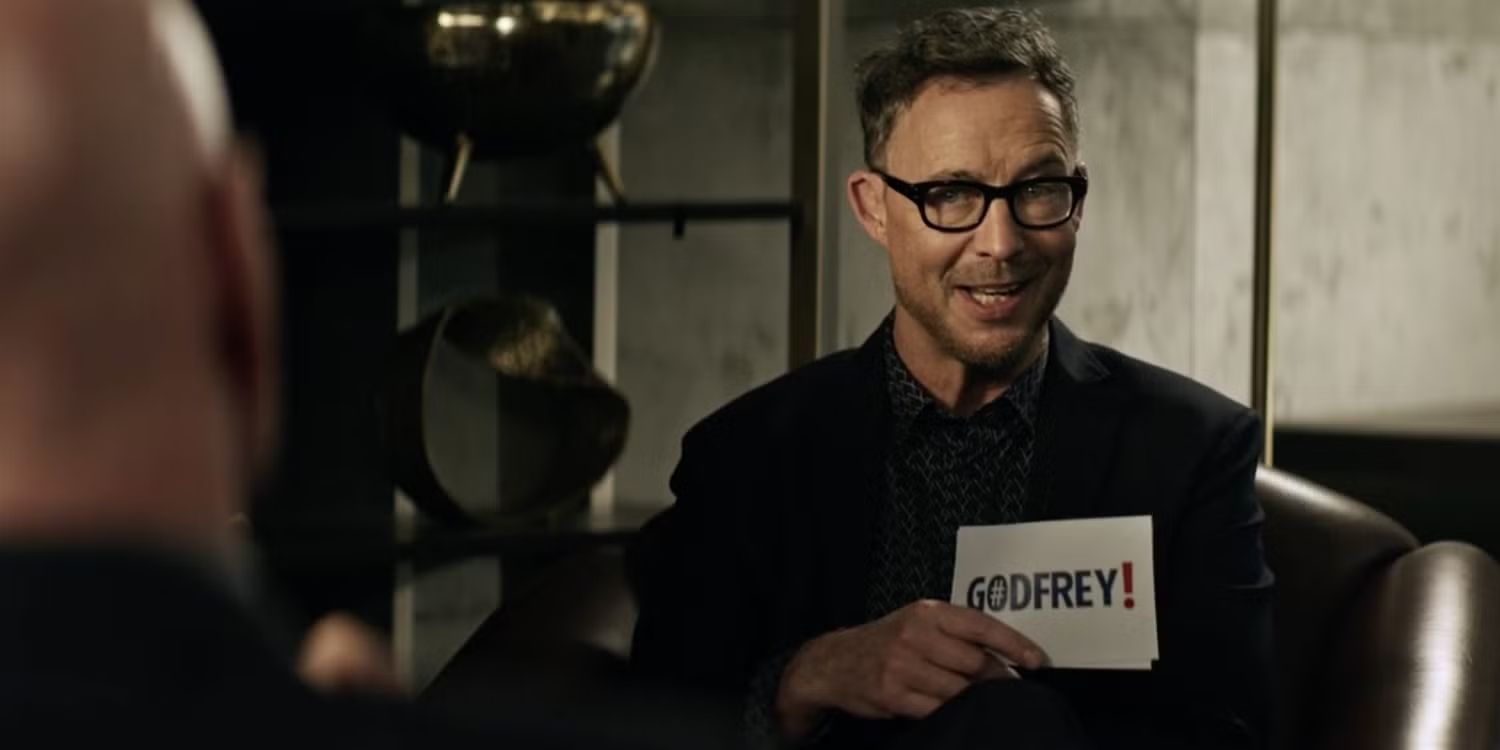 Tom Cavanagh as Gordon Godfrey giving an interview in Superman and Lois