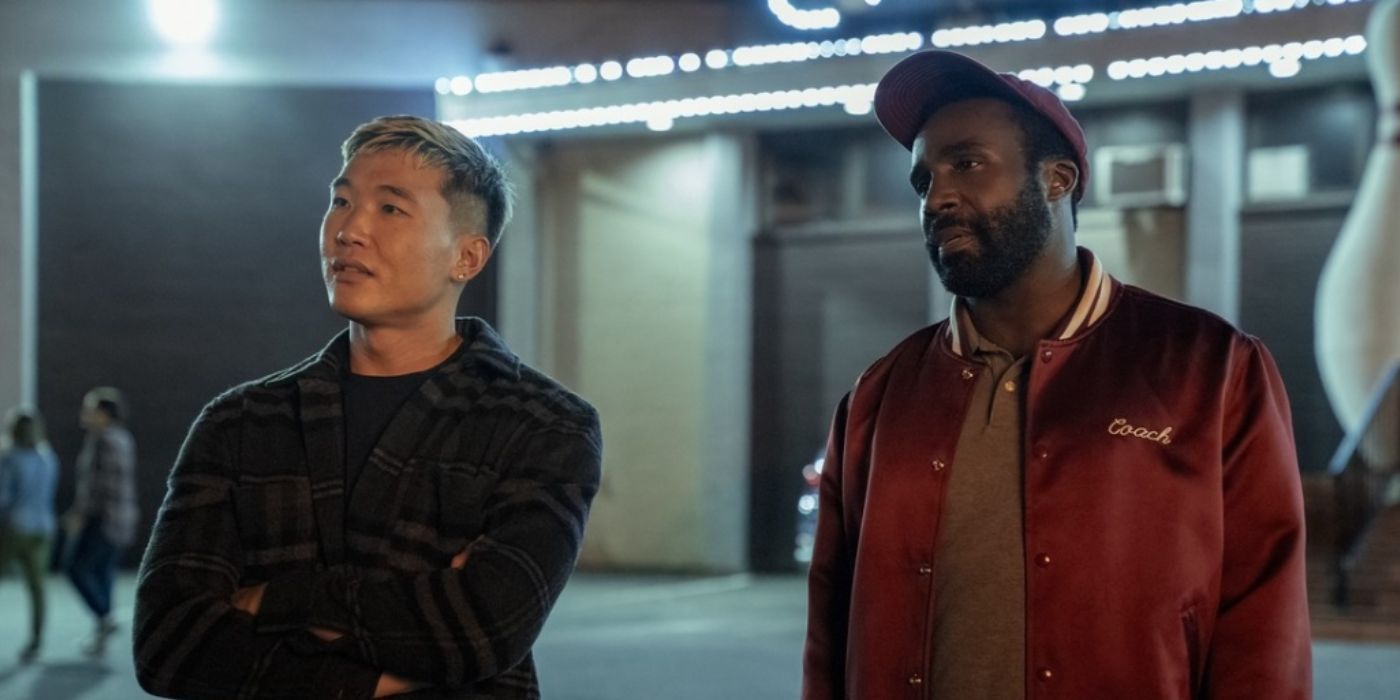Joel Kim Booster and Tramell Tillman standing next to each other in front of a bowling alley in &lsquo;Sweethearts&rsquo;.