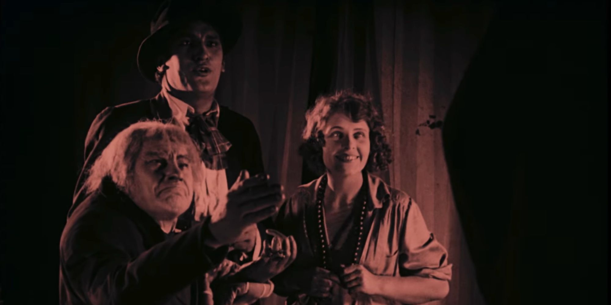 The waxworks proprietor (John Gottowt) and Eva (Olga Belajeff) show the writer (William Dieterle) the wax models in &lsquo;Waxworks&rsquo; (1924).