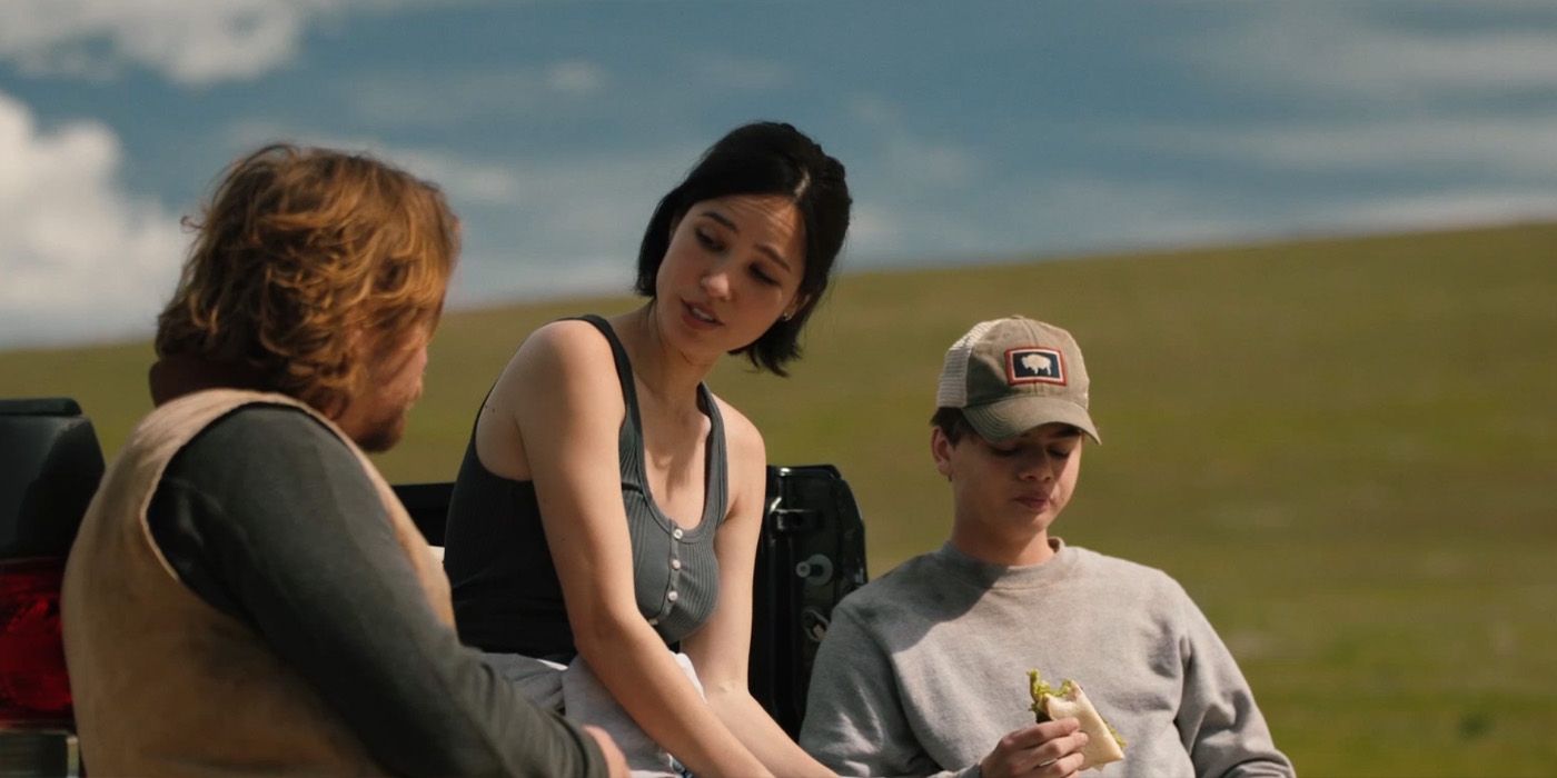 Kayce (Luke Grimes), Monica (Kelsey Asbille), and Tate Dutton (Brecken Merrill) eat lunch together on Yellowstone