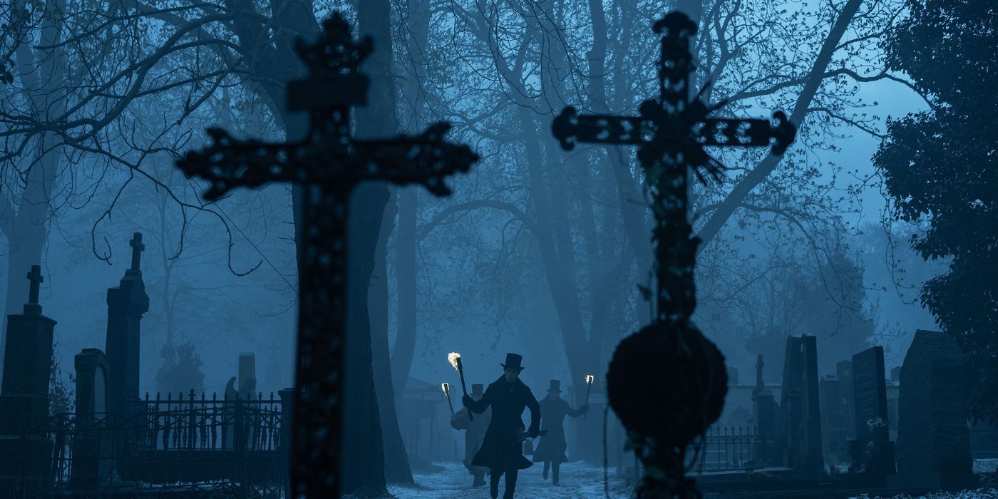 A group of men approached two crosses in a cemetery in Nosferatu.