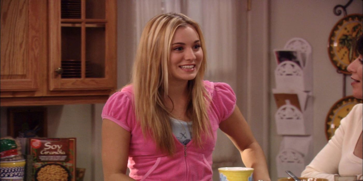 Kaley Cuoco as Bridget smiling in the kitchen in 8 Simple Rules 