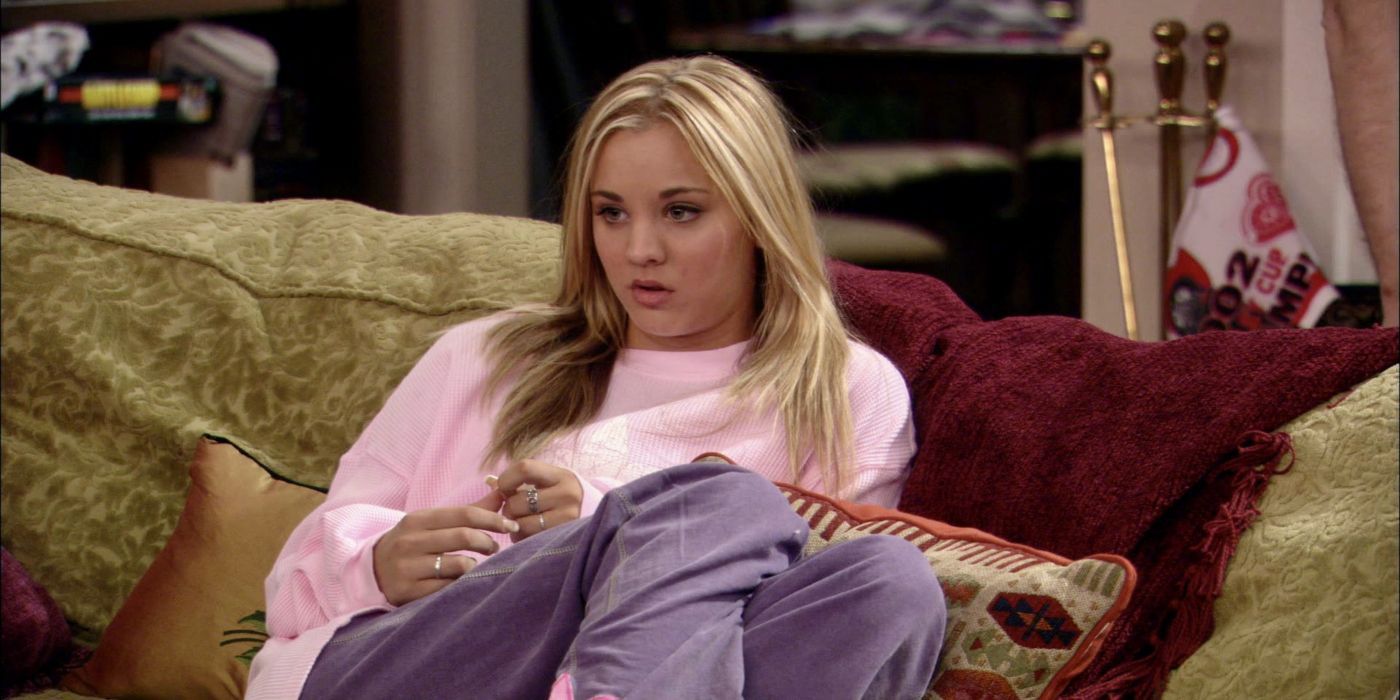 Kaley Cuoco as Bridget sitting bored on the couch in 8 Simple Rules 