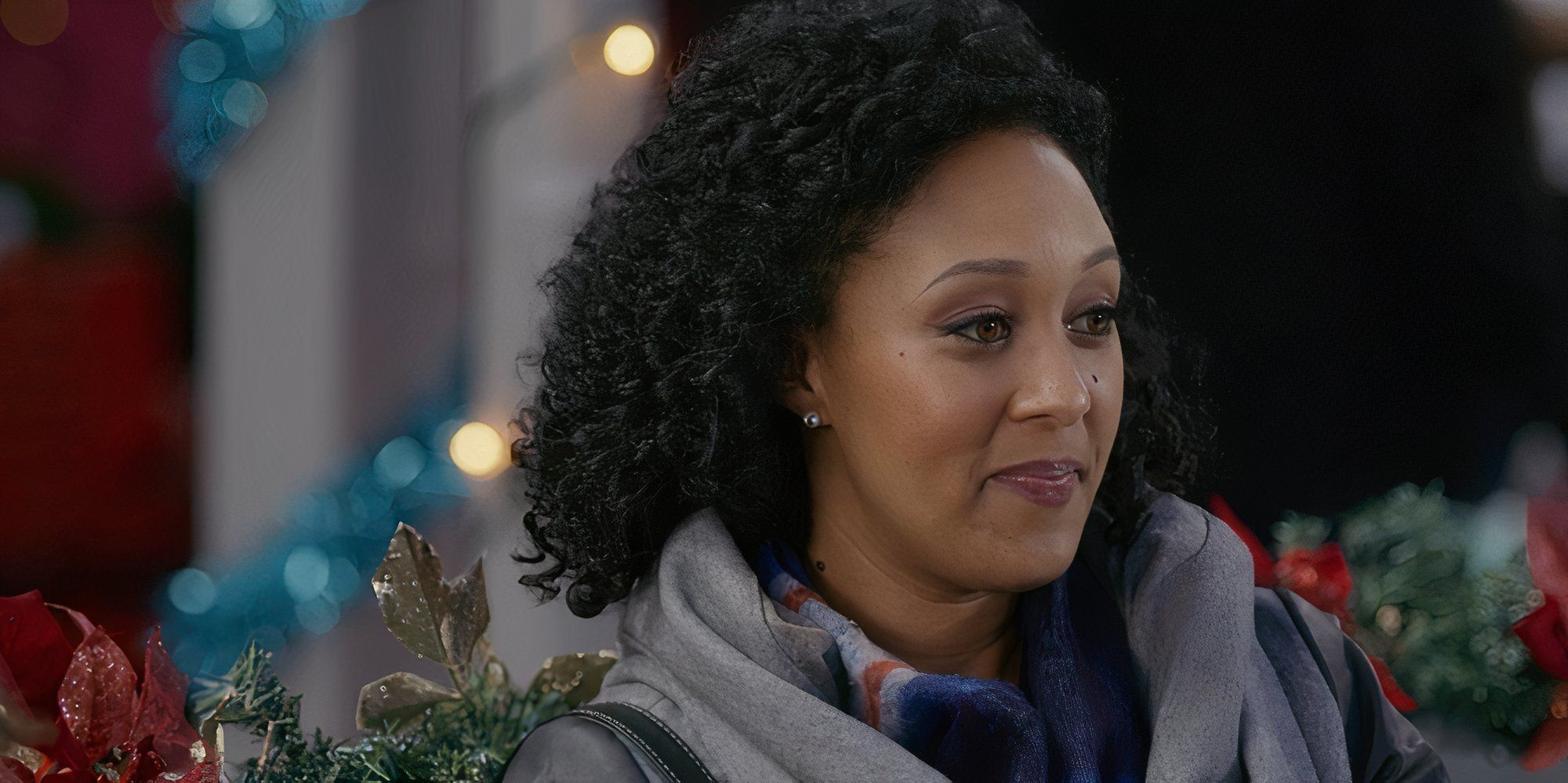 Tamera Mowry-Housley as Emma in A Christmas Miracle.