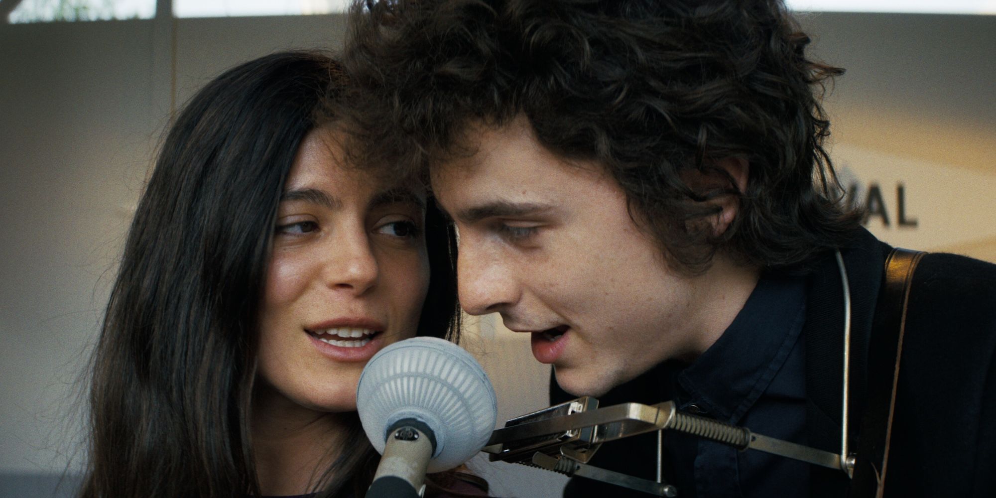 Monica Barbaro as Joan Baez and Timothée Chalamet as Bob Dylan in A Complete Unknown