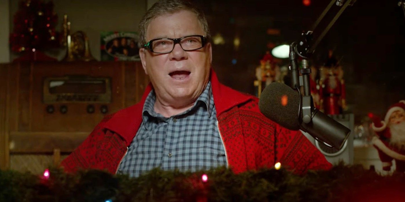 William Shatner in a radio DJ booth wearing a festive red zip-up sweater in &ldquo;A Christmas Horror Story&rdquo;