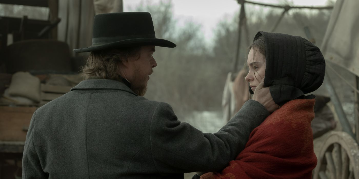 Joe Tippett touches the side of Betty Gilpin's face in 'American Primeval'