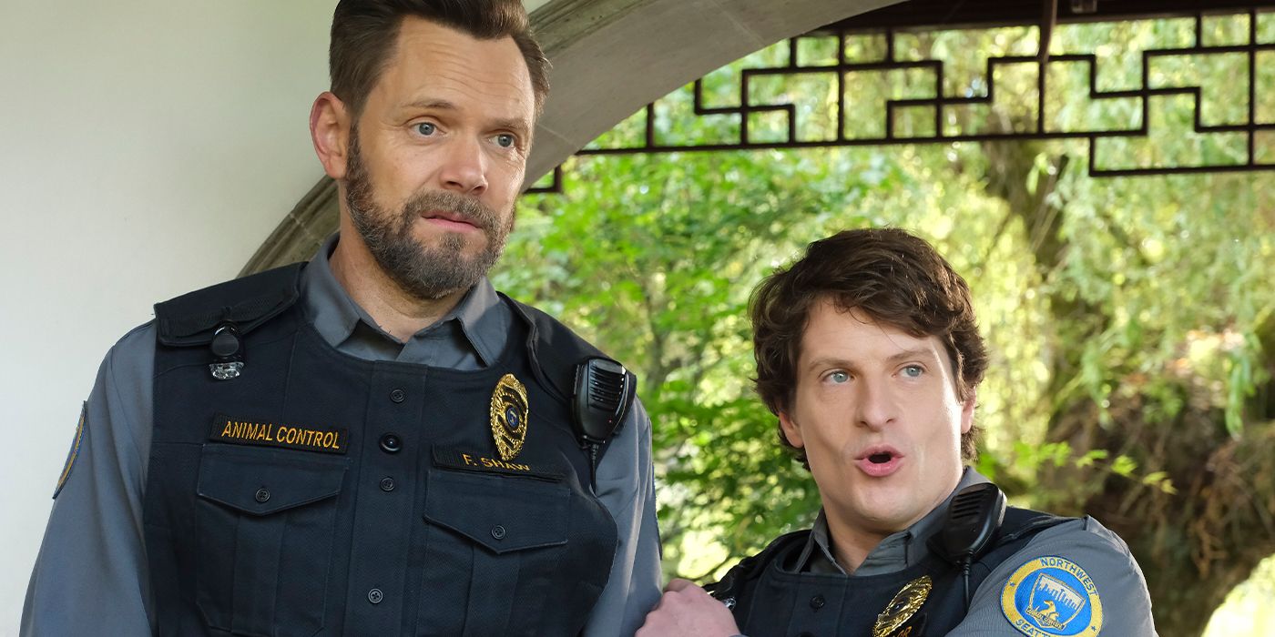 Joel McHale looks sad as Michael Rowland pumps him up in a scene from Animal Control Season 3