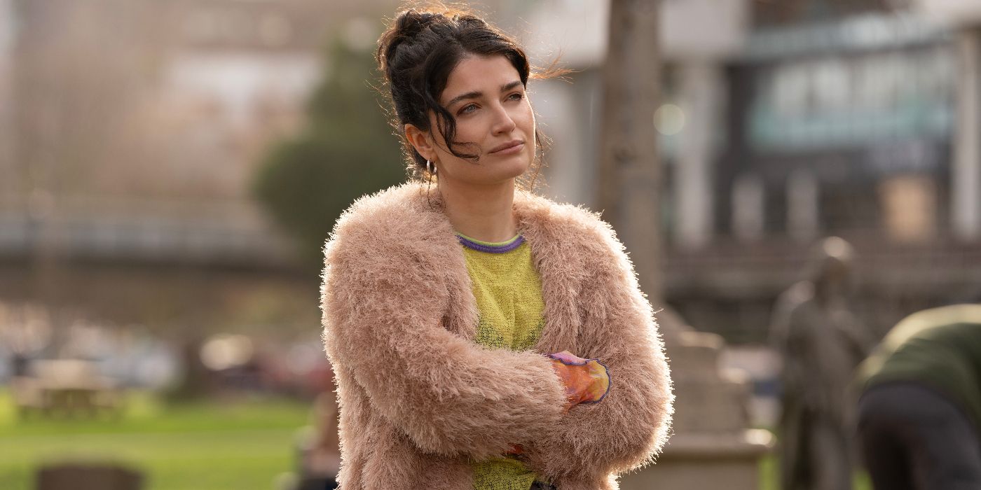 Eve Hewson standing with her arms crossed