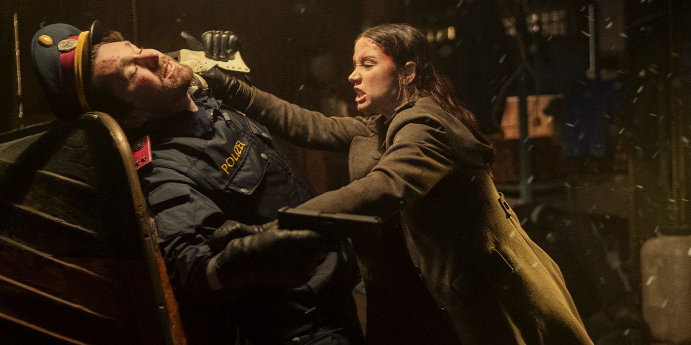 Eve Macarro (Ana de Armas) attacking a man in a police uniform in Ballerina