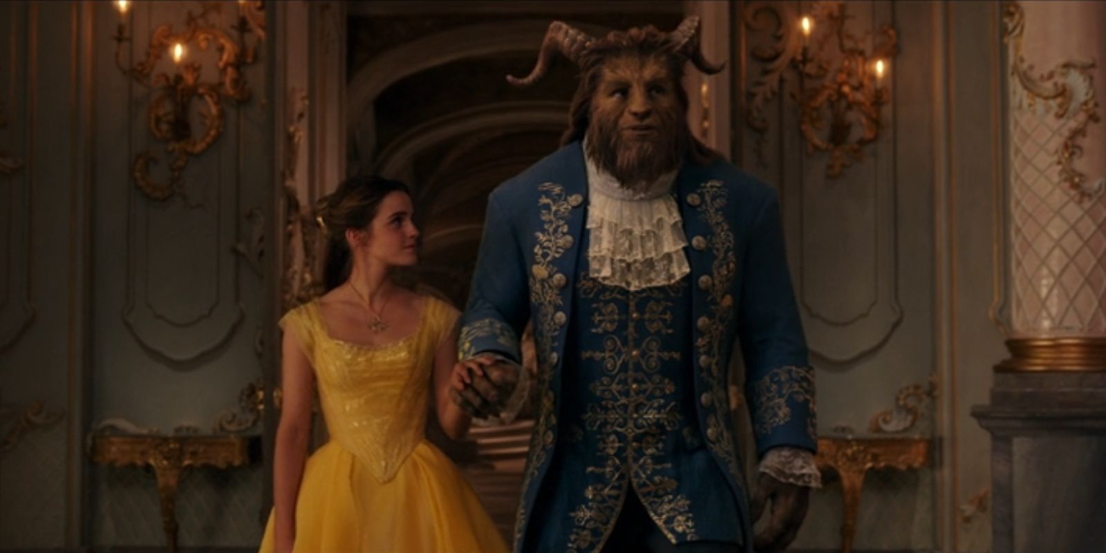 Belle, played by Emma Watson, holds hands with the Beast, played by Dan Stevens, in 'Beauty and the Beast'.