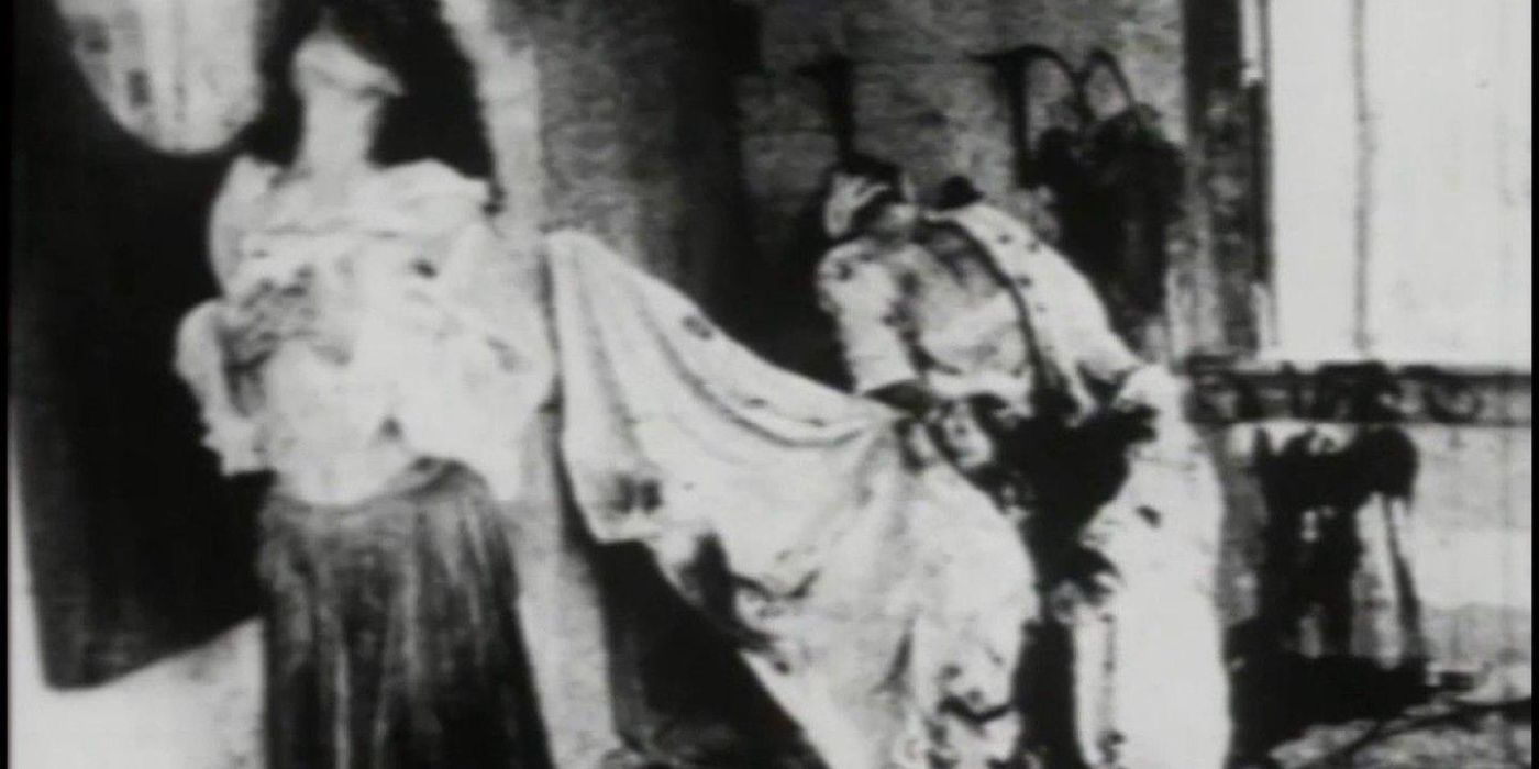Mother Earth, portrayed by Donna Dempsey, emerges from God's (Brian Salzberg) dead and mutilated dead body.