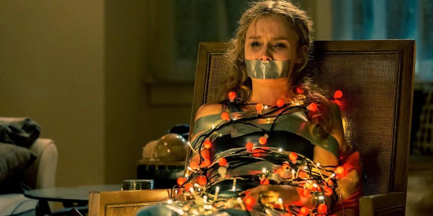 Ashley (Olivia DeJonge) tied up in Christmas lights in &lsquo;Better Watch Out&rsquo;