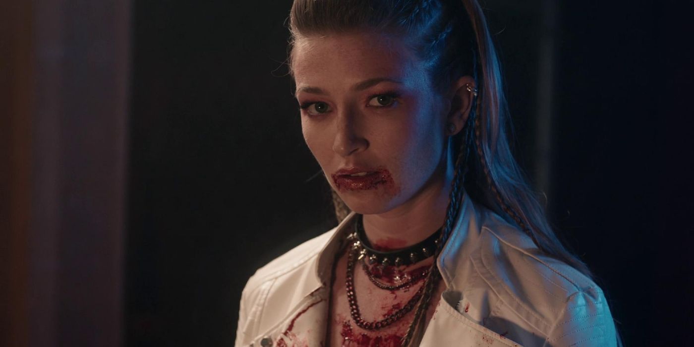 A female vampire with blood on her lips in Bit