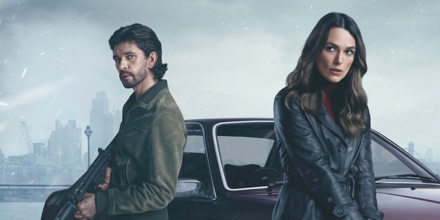 Ben Whishaw and Keira Knightley standing in front of a car with guns drawn