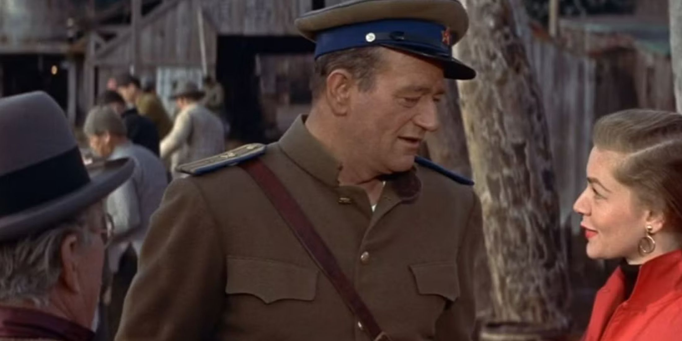 John Wayne speaking to Lauren Bacall in Blood Alley