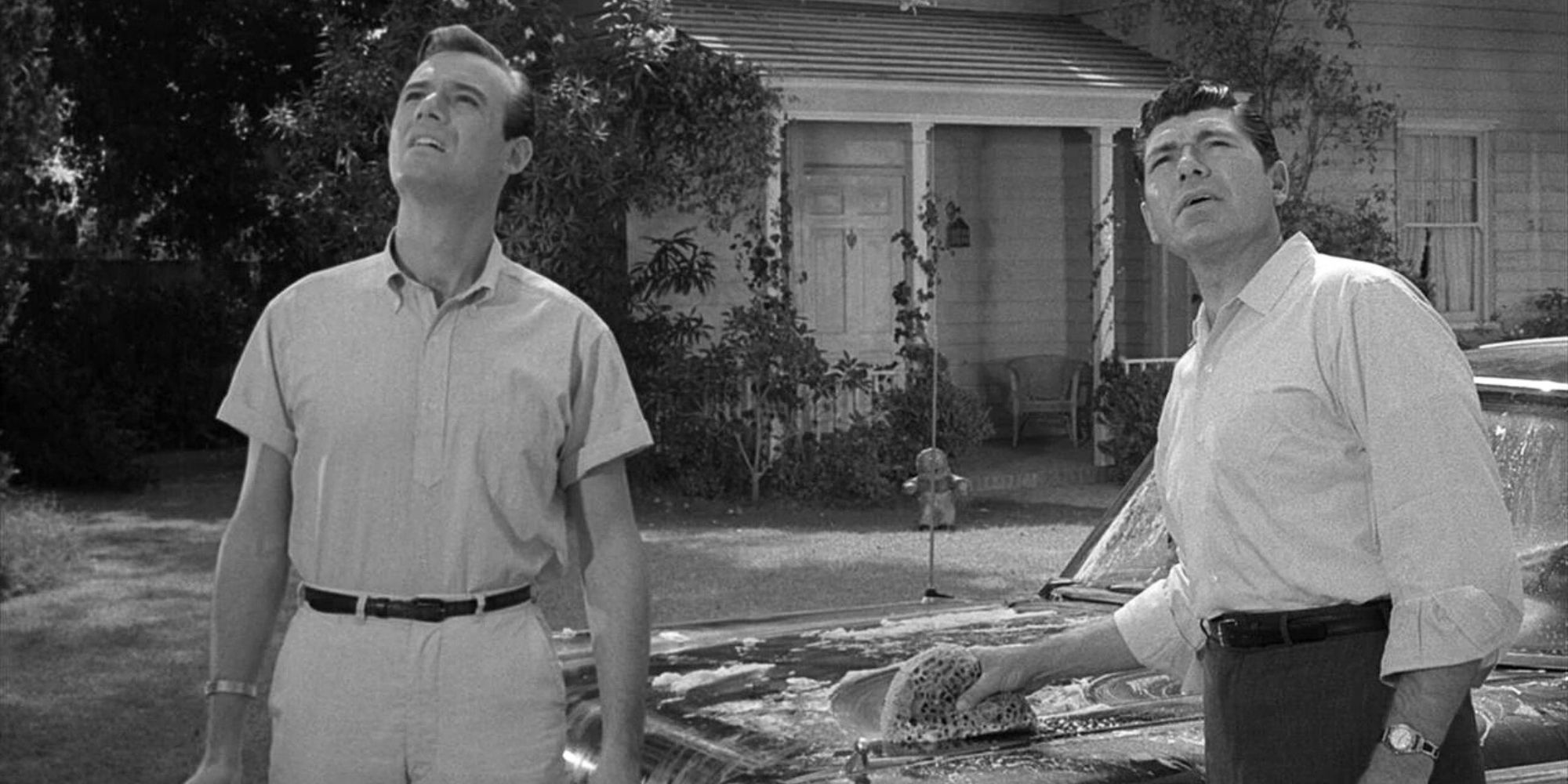 Burt Metcalfe and Claude Akins look to the sky in The Twilight Zone, The Monsters Are Due on Maple Street.