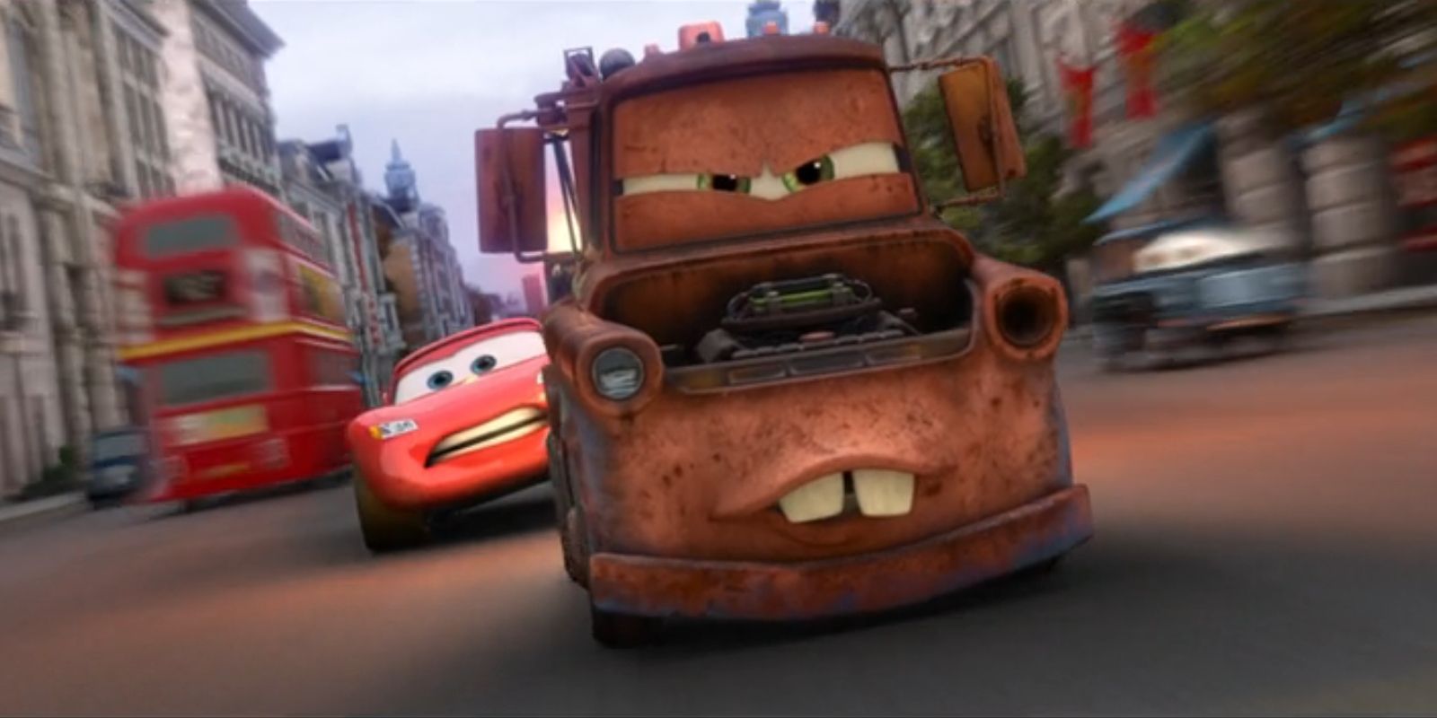 Mater, voiced by Larry the Cable Guy, tows Lightning McQueen, voiced by Owen Wilson, down a road in 'Cars 2'.