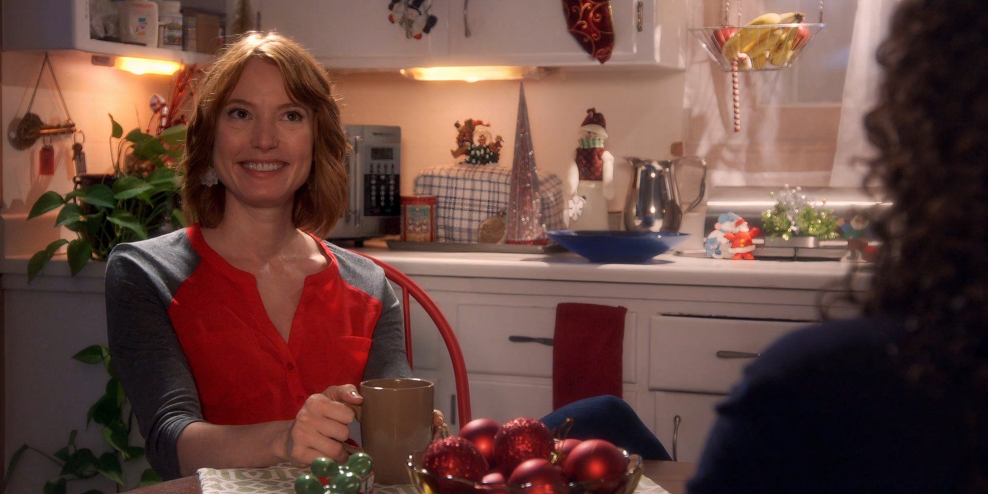 Alicia Witt as Nicky smiles in Christmas at Cartwright&rsquo;s.