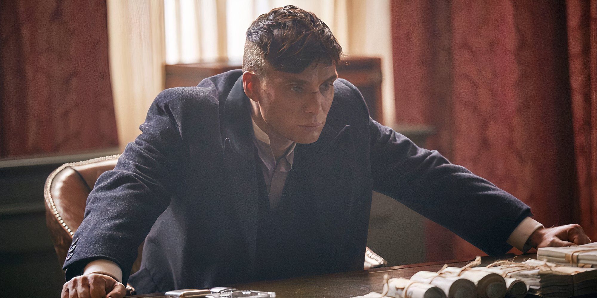 Cillian Murphy as Tommy Shelby in Peaky Blinders looking pensive