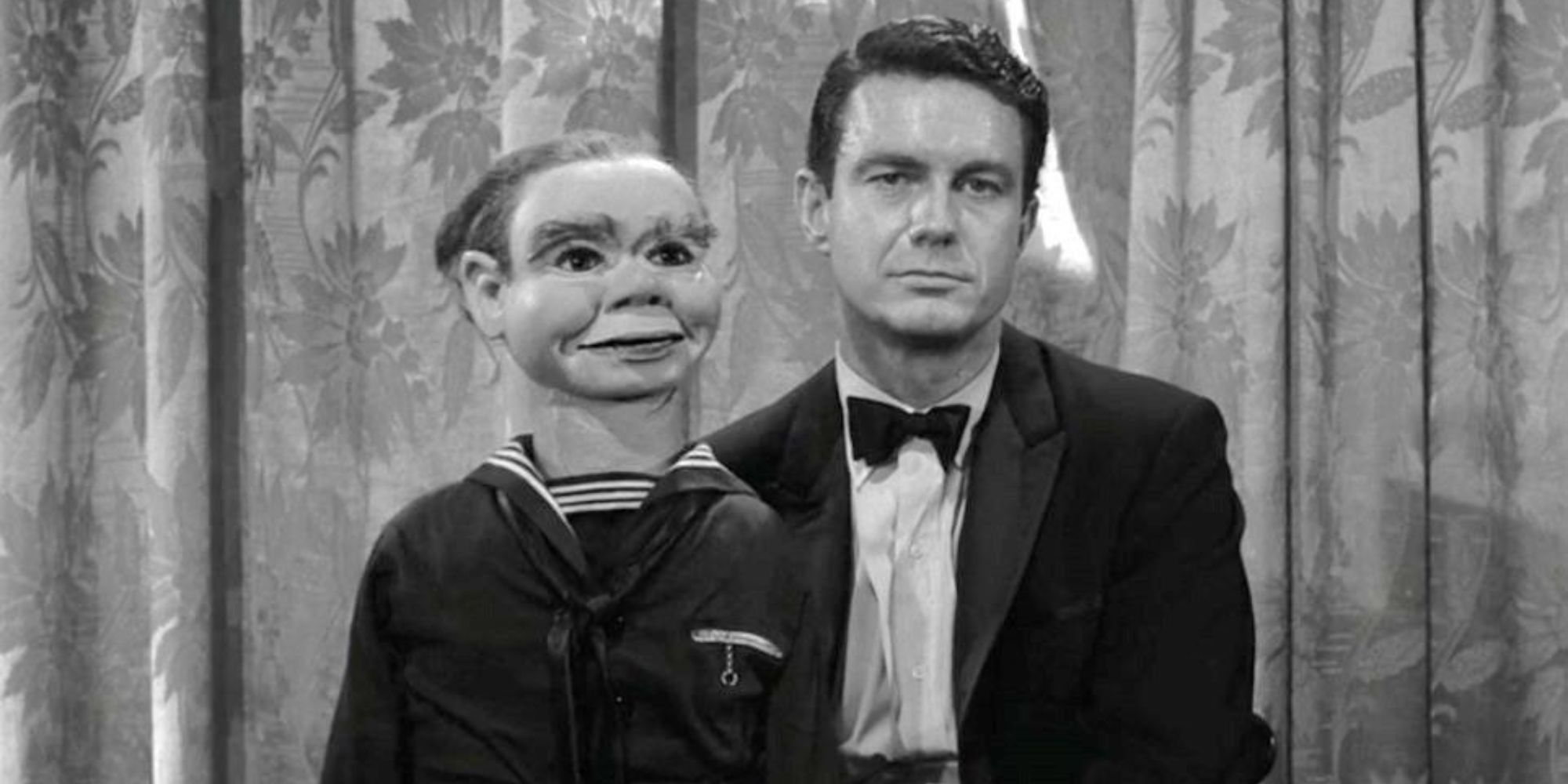 Cliff Robertson sits on stage with a ventriloquist dummy on his lap in The Twilight Zone episode The Dummy.