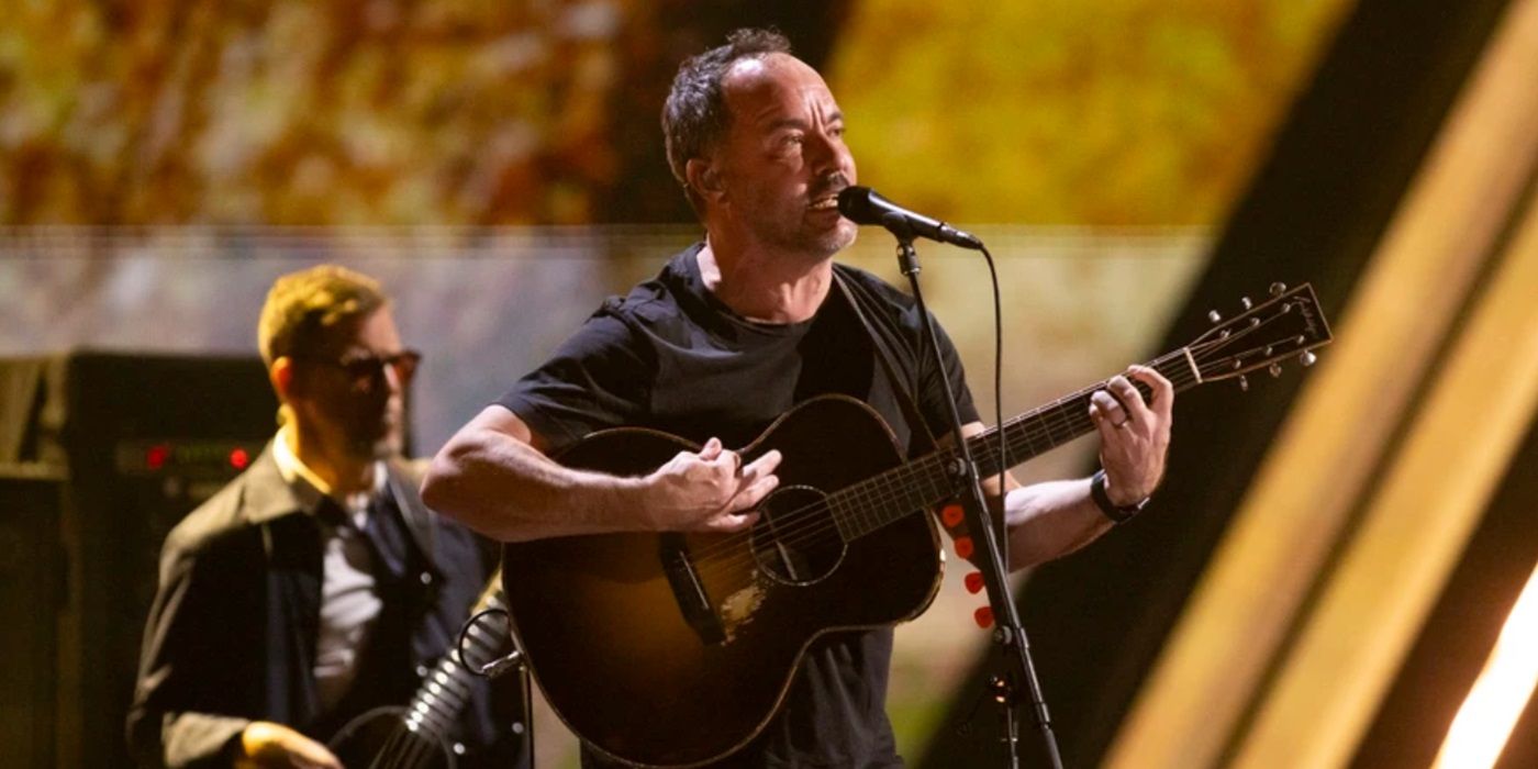 Dave Matthews Band singing while playing guitar at the 2024 Rock and Roll Hall of Fame Induction Ceremony