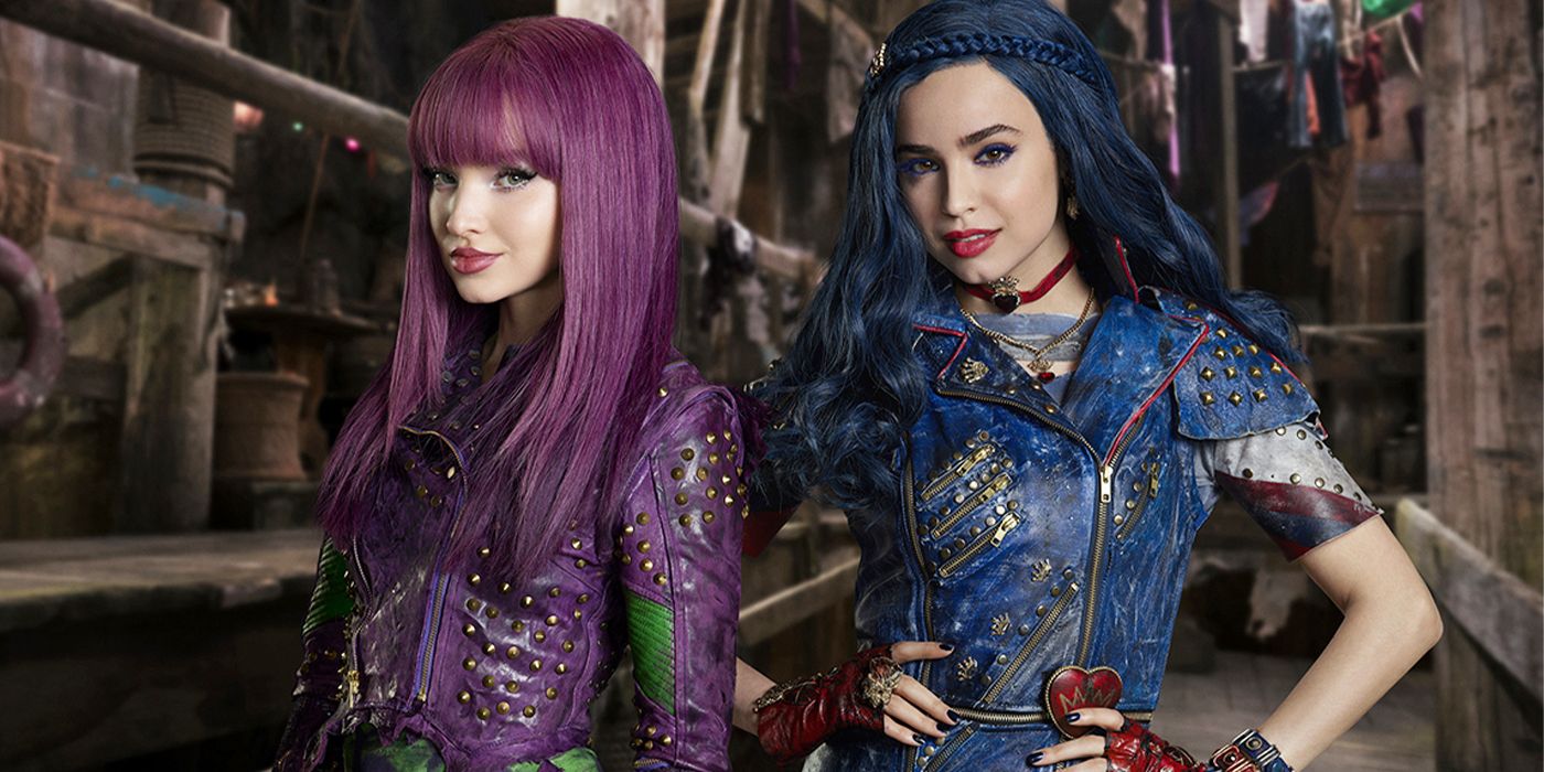 Mal (Dove Cameron) and Evie (Sofia Carson) posing in Descendants 2
