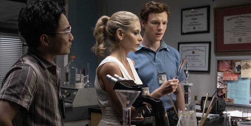 Alex Shimizu, Sarah Michelle Gellar, and Patrick Gibson observing evidence in Dexter: Original Sin