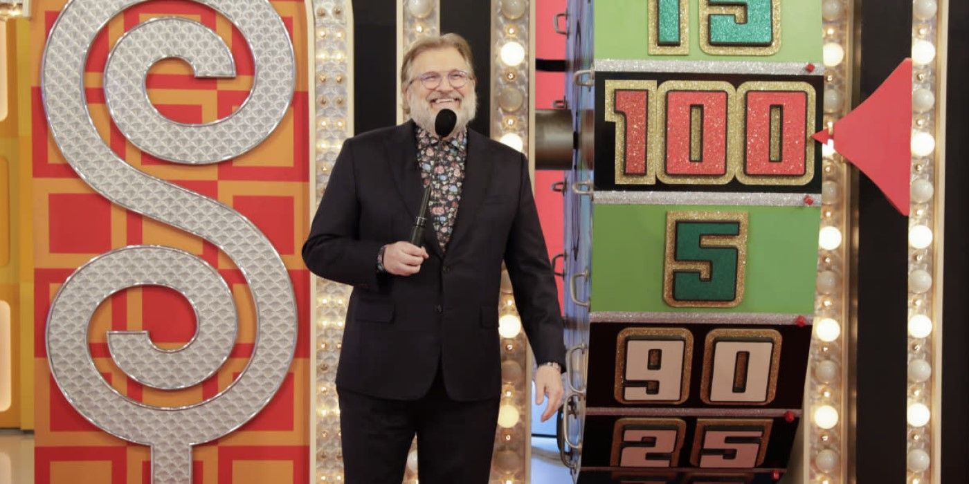Host Drew Carey stands beside "The Big Wheel" on 'The Price is Right'