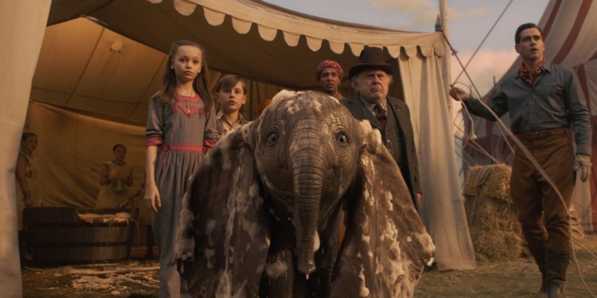 Dumbo the elephant and many members of the cast look ahead in 'Dumbo'.