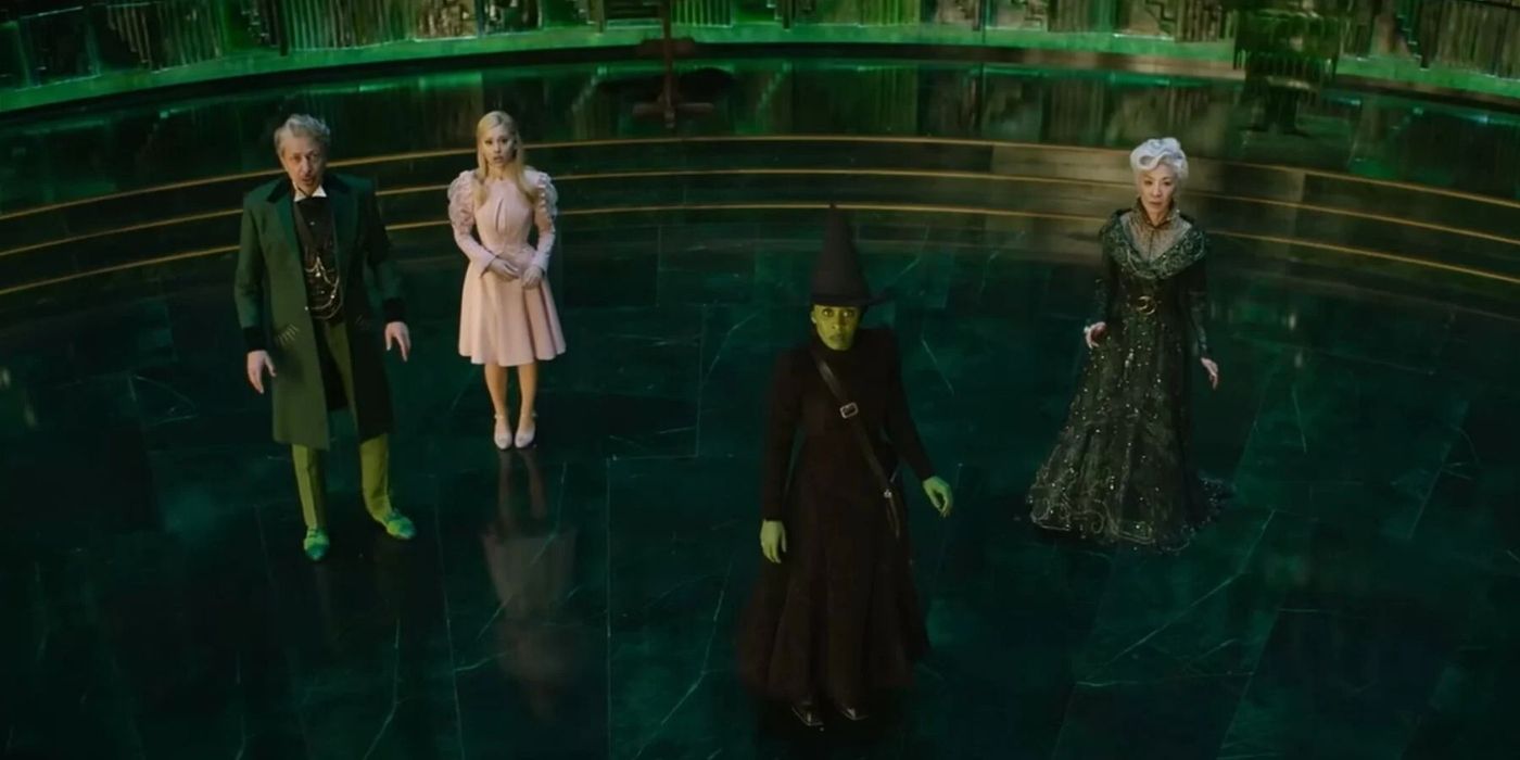 Cynthia Erivo, Jeff Goldblum, Ariana Grande, Michelle Yeoh in a large room as their characters in Wicked.