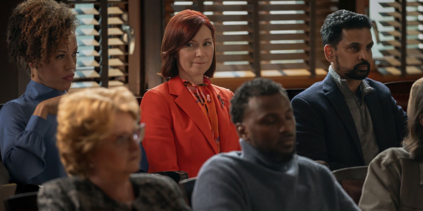 Carrie Preston sitting in a jury box in Elsbeth Season 2 Episode 7