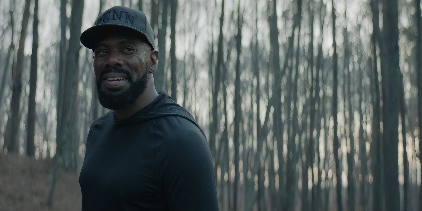 Colman Domingo as Muncie Daniels smiles in the woods in The Madness.