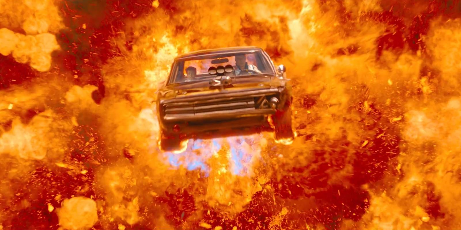 Dominic Toretto, played by Vin Diesel, drives a car out of an explosion while his son, played by Leo Abelo Perry, sits in the passenger seat in &lsquo;Fast X&rsquo;.