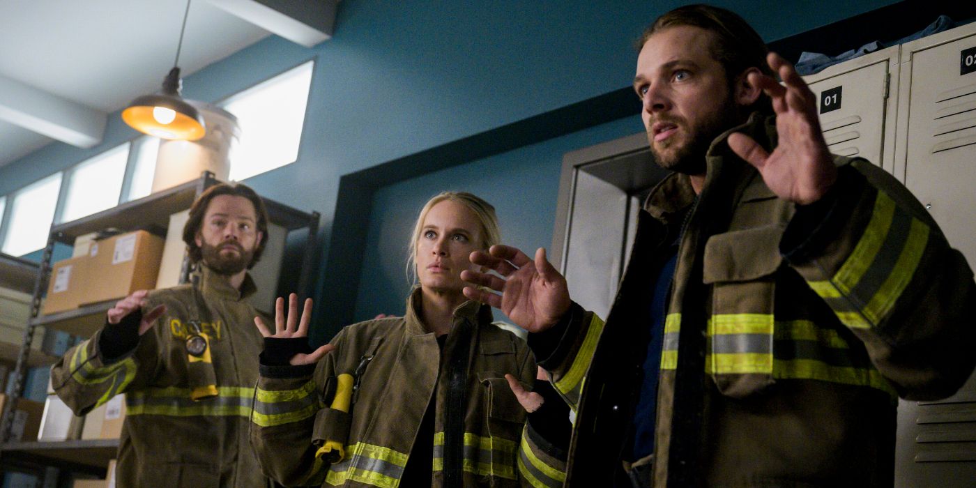 Jared Padalecki, Leven Rambin, and Max Thieriot all holding their hands up while in firefighter gear